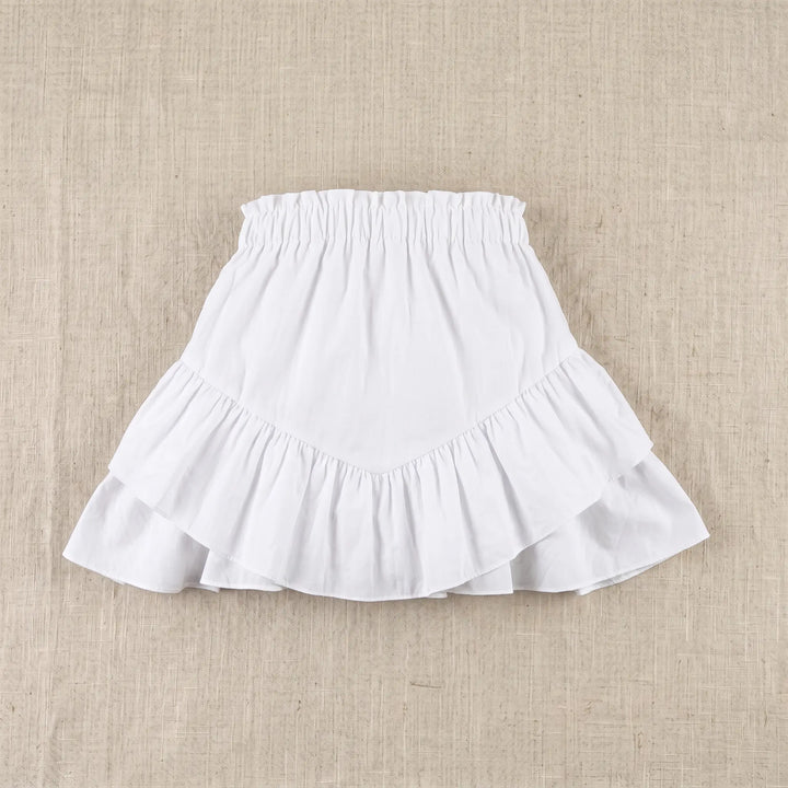 Elarae white mini skirt with tiered ruffles and an elasticated waistband, shown flat on a textured neutral background.
