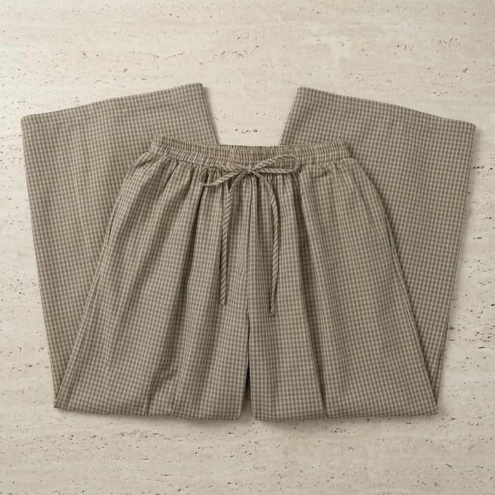 Zelphyr high-rise wide-leg trousers in a fine oat beige plaid pattern, shown laid flat with an elasticated waistband and gathered ankle.